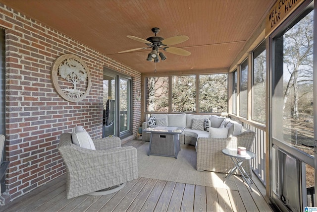 sunroom with wood ceiling and ceiling fan