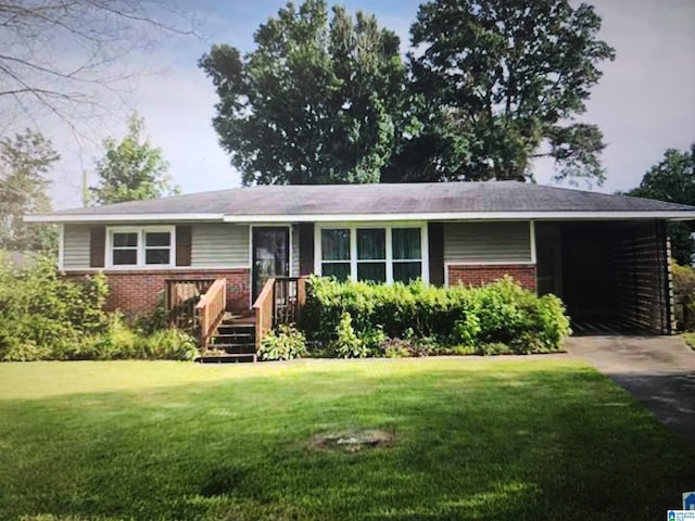 ranch-style home featuring a front yard and a carport