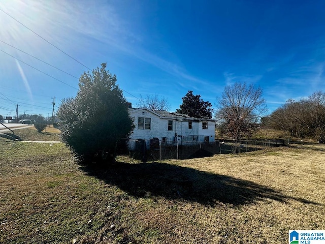 view of property exterior featuring a lawn