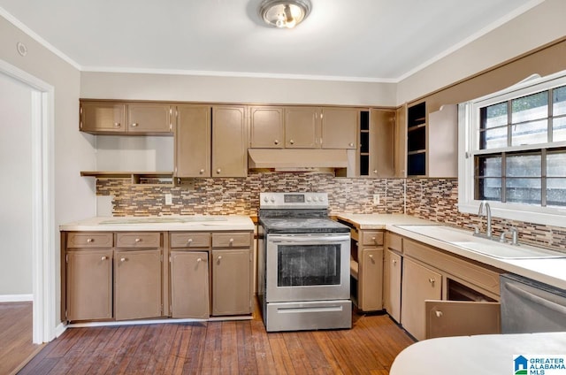 kitchen featuring sink, wood-type flooring, ornamental molding, appliances with stainless steel finishes, and decorative backsplash