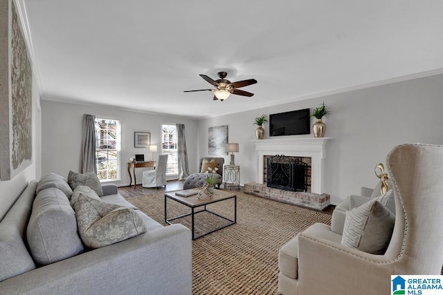 living room with ceiling fan, ornamental molding, light hardwood / wood-style floors, and a brick fireplace