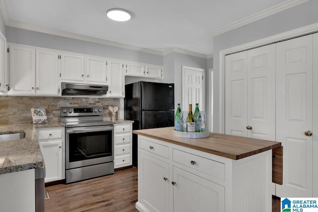 kitchen with electric stove, white cabinetry, ventilation hood, and black fridge