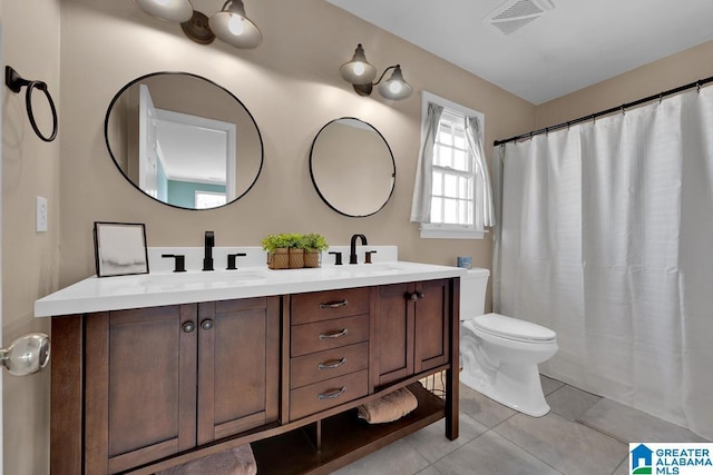 bathroom with vanity, tile patterned floors, toilet, and a shower with shower curtain