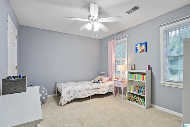 carpeted bedroom featuring ceiling fan