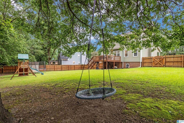 view of yard featuring a playground and a deck