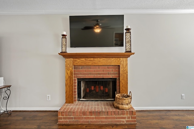 details with hardwood / wood-style floors, crown molding, a textured ceiling, and a brick fireplace