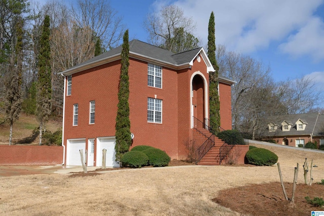 view of side of property featuring a garage