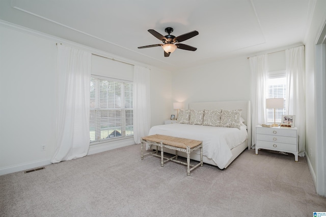 carpeted bedroom with ceiling fan