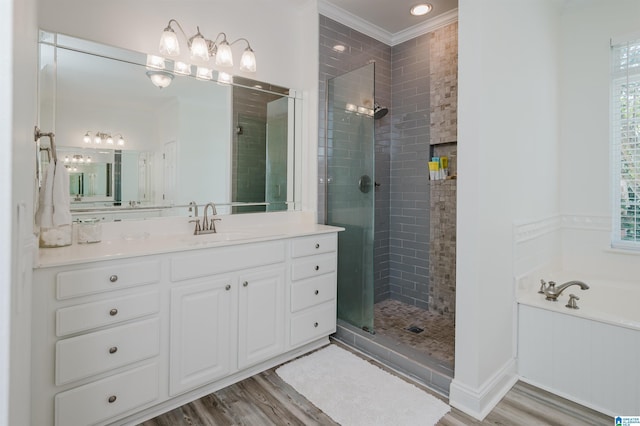 bathroom with hardwood / wood-style flooring, vanity, crown molding, and independent shower and bath