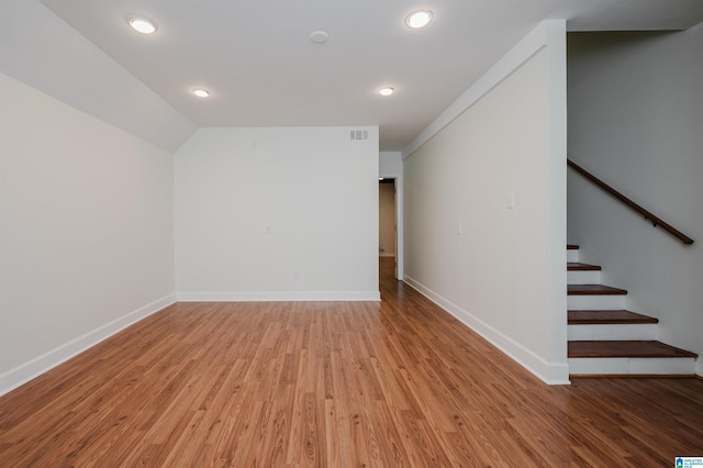 additional living space featuring wood-type flooring