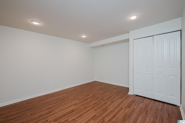 basement featuring hardwood / wood-style floors