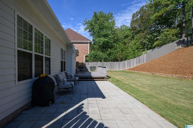 view of patio featuring area for grilling and a deck