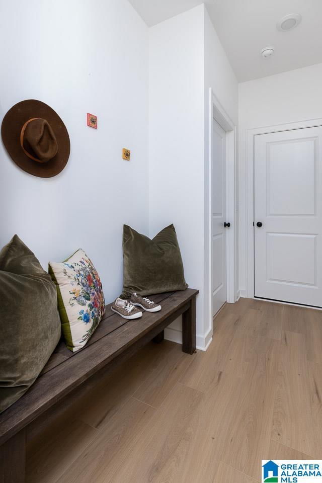 mudroom with light hardwood / wood-style floors