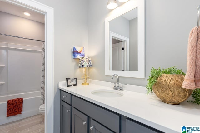 full bathroom featuring vanity, toilet, and shower / bath combination