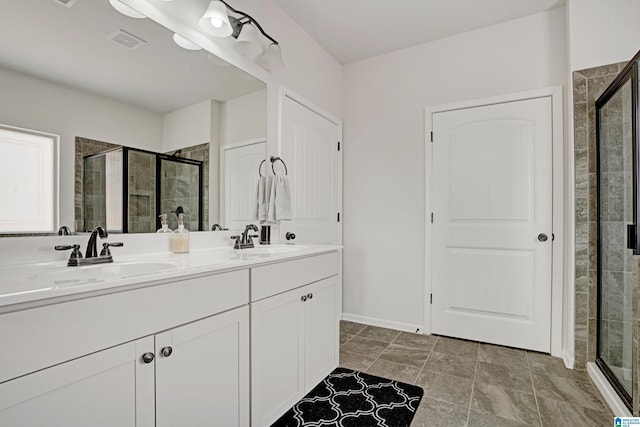 bathroom with an enclosed shower and vanity