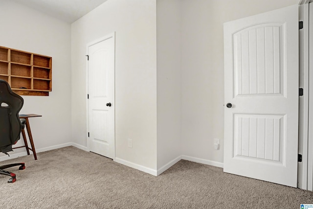 unfurnished office featuring light colored carpet