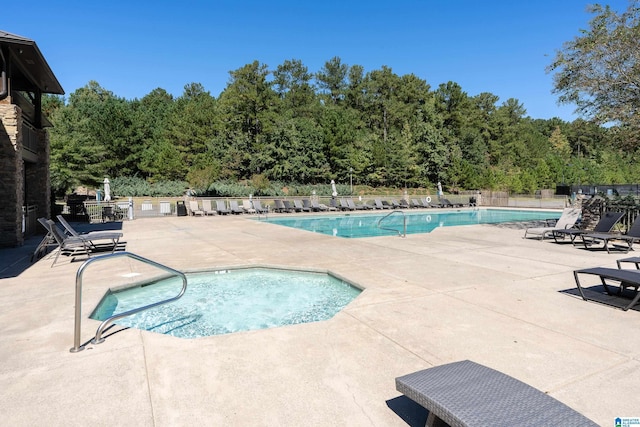 view of pool featuring a patio