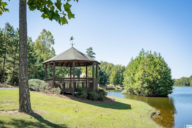 view of community featuring a gazebo, a water view, and a yard