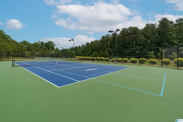 view of tennis court featuring basketball court