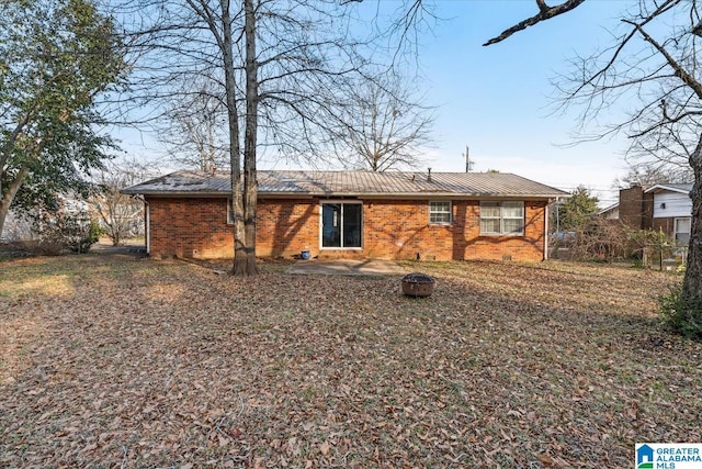 rear view of property featuring a patio