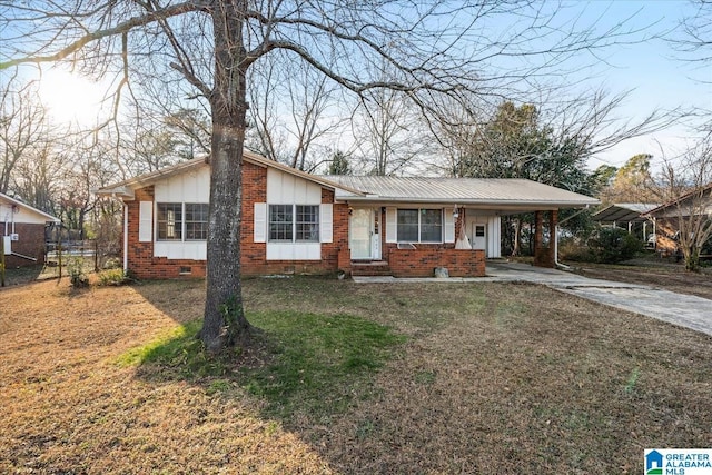 ranch-style home with a carport and a front lawn