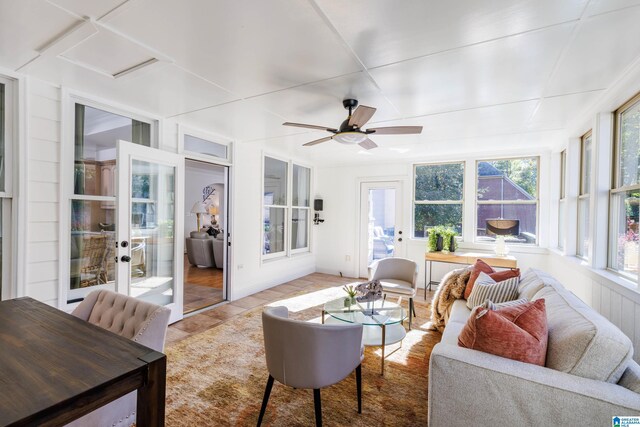 sunroom / solarium featuring ceiling fan