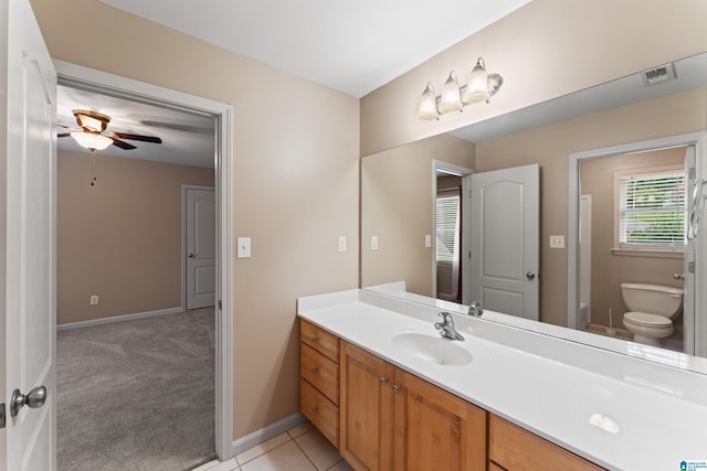 bathroom featuring vanity, ceiling fan, tile patterned floors, and toilet