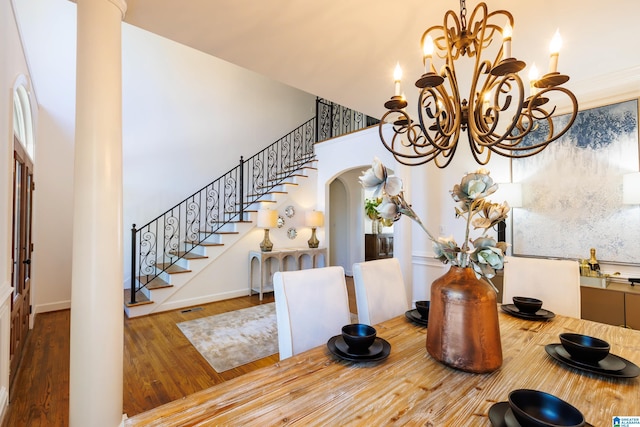 interior space with hardwood / wood-style floors and a notable chandelier