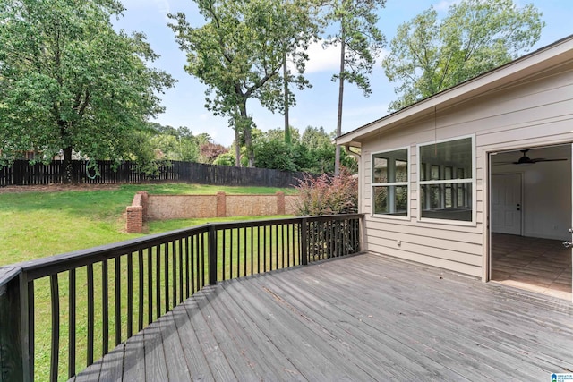 wooden deck featuring a yard