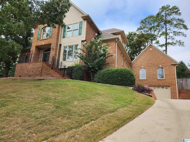 front of property featuring a garage and a front lawn