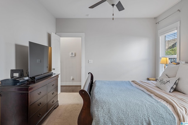 bedroom with ceiling fan and carpet flooring