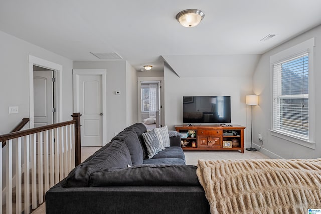 carpeted living room with lofted ceiling