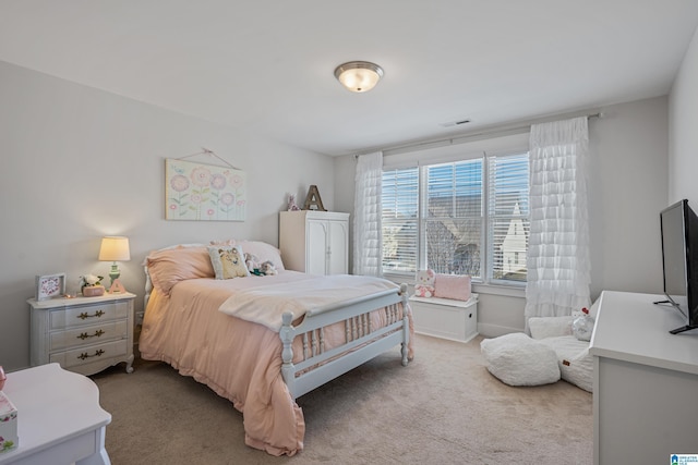 bedroom featuring light colored carpet