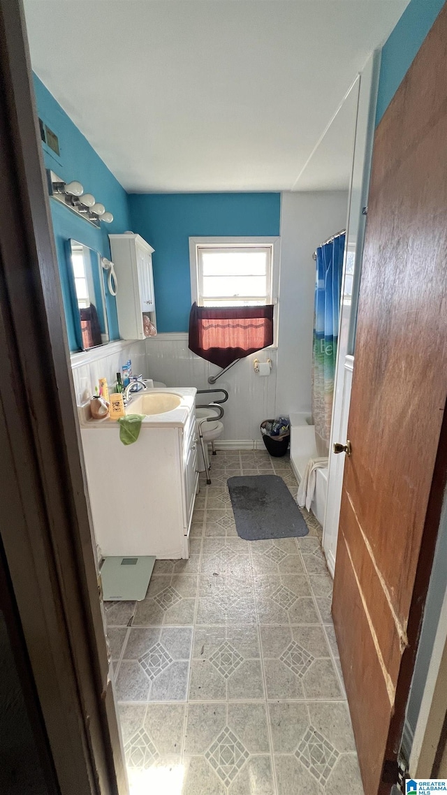 bathroom with vanity, toilet, and a shower with curtain