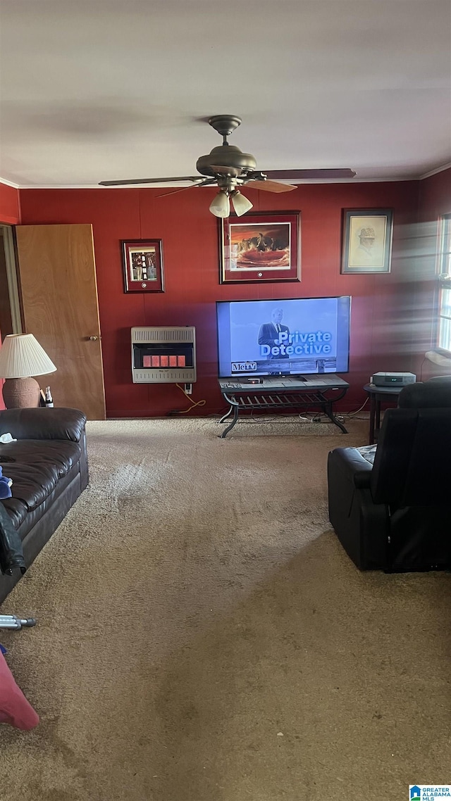 carpeted living room featuring heating unit and ceiling fan