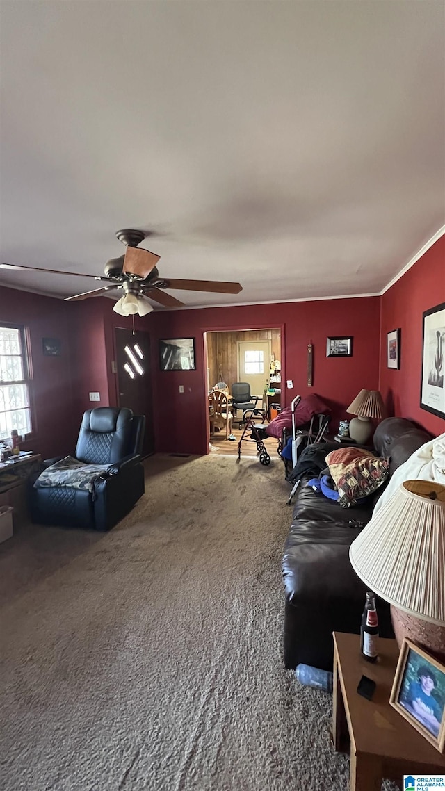 carpeted living room featuring ceiling fan