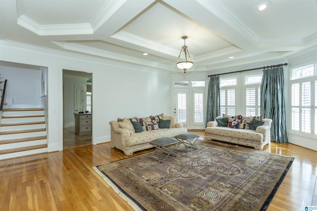 living room featuring beamed ceiling, crown molding, coffered ceiling, and hardwood / wood-style floors