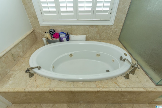 bathroom with tiled bath