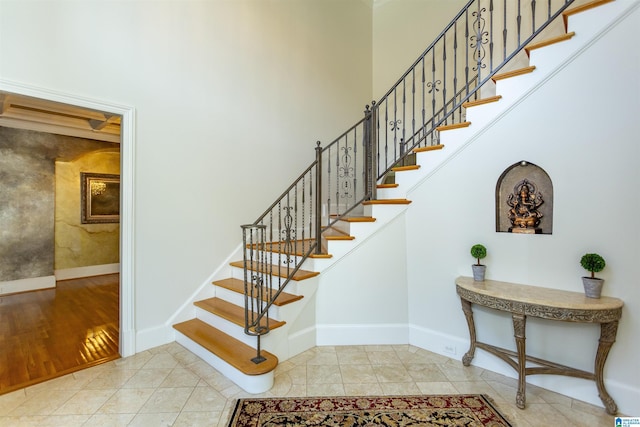 stairs featuring tile patterned flooring