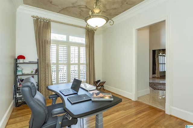 home office with ornamental molding and light wood-type flooring