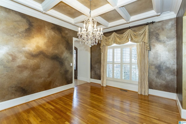 unfurnished dining area featuring crown molding, coffered ceiling, and hardwood / wood-style floors