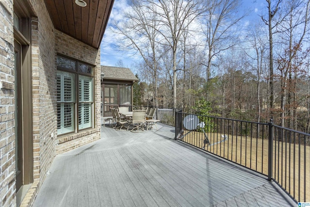 wooden terrace with a sunroom