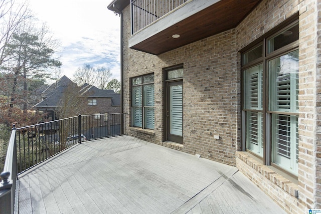 view of patio featuring a balcony