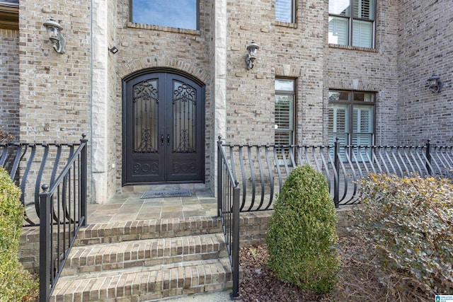 property entrance featuring french doors