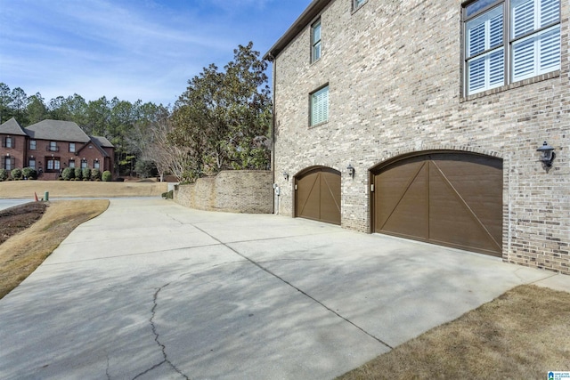 view of side of property with a garage