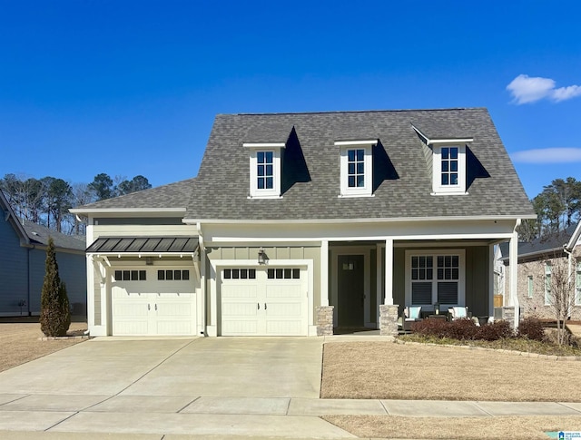 view of front of home featuring a garage and covered porch