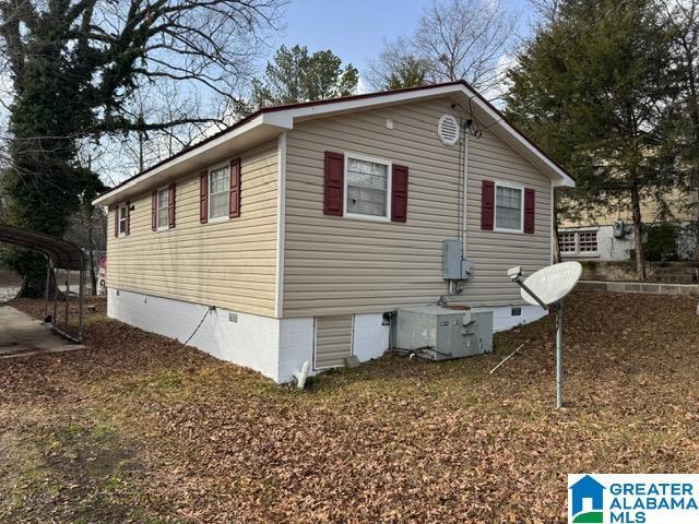 view of side of property with crawl space