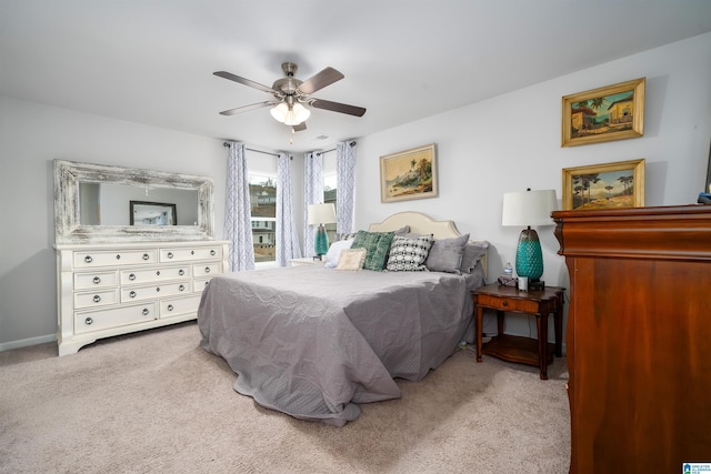 bedroom featuring ceiling fan and light colored carpet