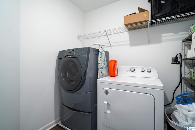 laundry room with washing machine and dryer