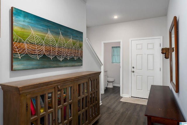 hallway featuring dark hardwood / wood-style flooring